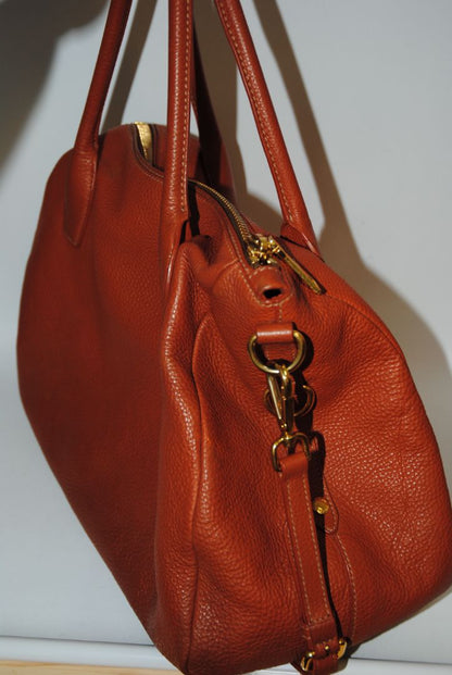 Burnt Orange / Papaya Prada Vitello Daino Zip Tote with Shoulder Strap, Length: 13.5 in (34 cm) Height: 10.5 in (27 cm) Depth: 6.5 in (17 cm) Handle Drop: 7.5 in (19 cm) Strap Drop: Up to 22 in adjustable