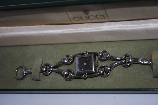 silver Gucci Gucci Horsebit Chain-Link Ladies Watch, Case Size: 20 mm (square) Bracelet Length: Fits wrists up to 6.5 in (16.5 cm) Bracelet Width: 10 mm