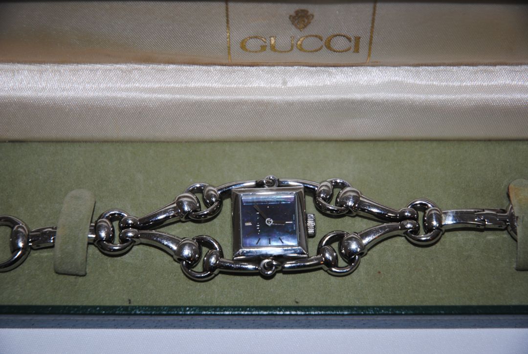 silver Gucci Gucci Horsebit Chain-Link Ladies Watch, Case Size: 20 mm (square) Bracelet Length: Fits wrists up to 6.5 in (16.5 cm) Bracelet Width: 10 mm