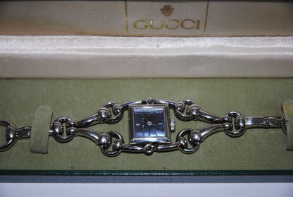 silver Gucci Gucci Horsebit Chain-Link Ladies Watch, Case Size: 20 mm (square) Bracelet Length: Fits wrists up to 6.5 in (16.5 cm) Bracelet Width: 10 mm