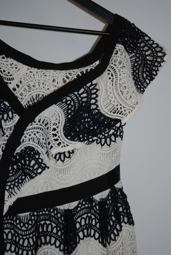 navy and white Self Portrait scalloped lace dress, Length: ~34 in (mini dress length) Bust: ~16 in across Waist: ~14 in across Size: Not visible, but appears similar to US 2–4 fit