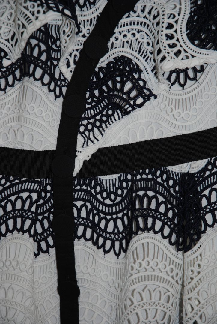 navy and white Self Portrait scalloped lace dress, Length: ~34 in (mini dress length) Bust: ~16 in across Waist: ~14 in across Size: Not visible, but appears similar to US 2–4 fit