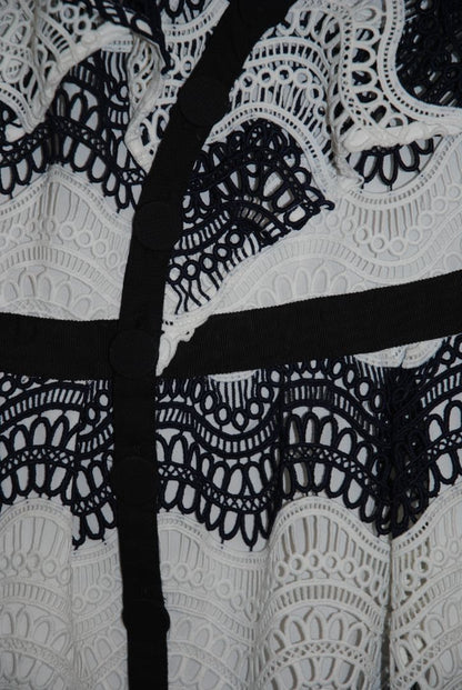 navy and white Self Portrait scalloped lace dress, Length: ~34 in (mini dress length) Bust: ~16 in across Waist: ~14 in across Size: Not visible, but appears similar to US 2–4 fit