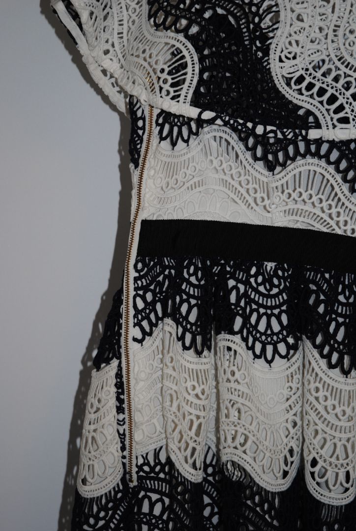 navy and white Self Portrait scalloped lace dress, Length: ~34 in (mini dress length) Bust: ~16 in across Waist: ~14 in across Size: Not visible, but appears similar to US 2–4 fit