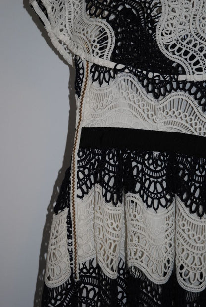 navy and white Self Portrait scalloped lace dress, Length: ~34 in (mini dress length) Bust: ~16 in across Waist: ~14 in across Size: Not visible, but appears similar to US 2–4 fit