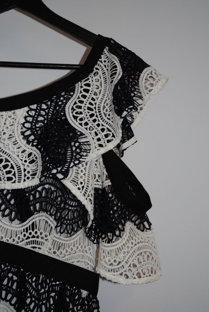 navy and white Self Portrait scalloped lace dress, Length: ~34 in (mini dress length) Bust: ~16 in across Waist: ~14 in across Size: Not visible, but appears similar to US 2–4 fit