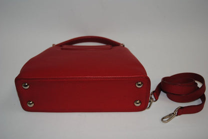 red taurillion leather Louis Vuitton Capucines Nano, measures 6.4 × 4.3 × 2.6 inches (16.3 × 10.9 × 6.6 cm).