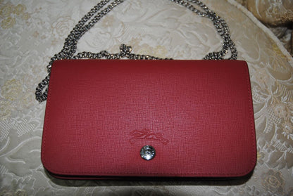 red Longchamp Le Foulonné Red Leather Crossbody Chain Bag, Dimensions Height: 5.5 in (14 cm) Width: 8.5 in (22 cm) Depth: 2 in (5 cm) Chain Strap Drop: 22 in (56 cm)