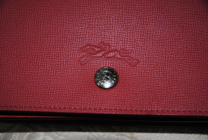 red Longchamp Le Foulonné Red Leather Crossbody Chain Bag, Dimensions Height: 5.5 in (14 cm) Width: 8.5 in (22 cm) Depth: 2 in (5 cm) Chain Strap Drop: 22 in (56 cm)