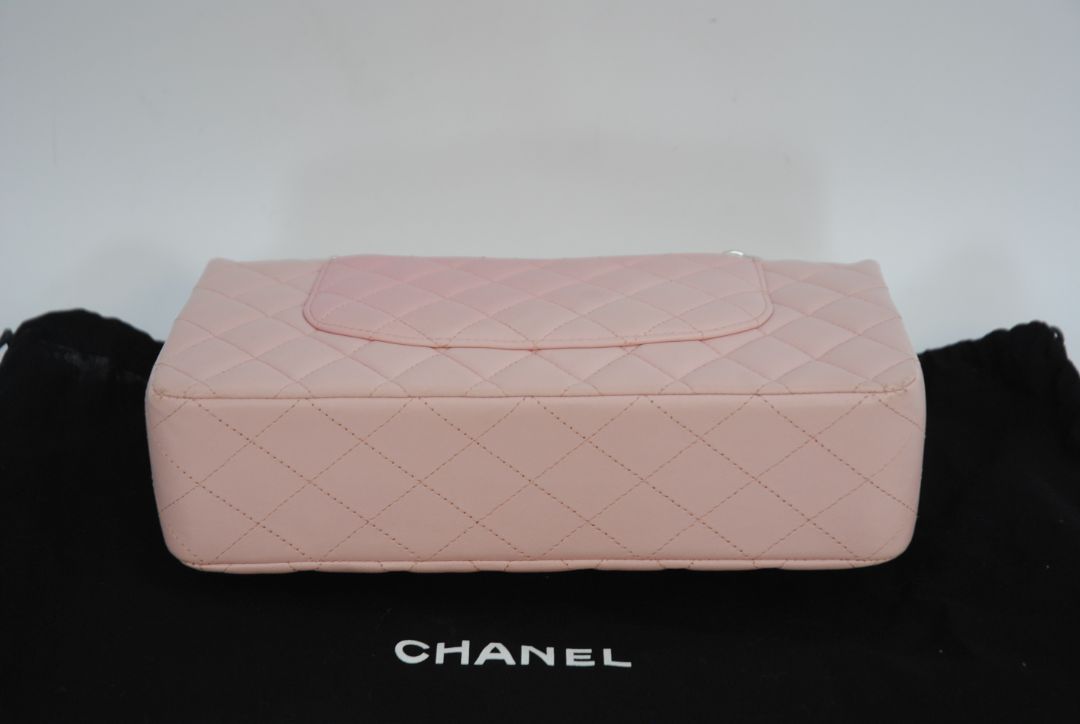 pink Chanel classic double flap, 25 cm width × ~16 cm height × ~7 cm depth (≈10″ × 6.3″ × 2.75″)
