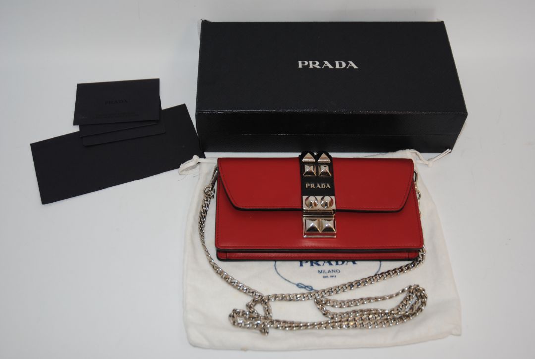 crimson red Prada flap chain bag, Width: 8.5 inches (21.5 cm) Height: 5 inches (12.5 cm) Depth: 2 inches (5 cm) Chain Strap Drop: 22 inches (56 cm)