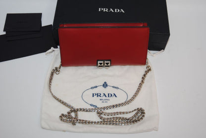 crimson red Prada flap chain bag, Width: 8.5 inches (21.5 cm) Height: 5 inches (12.5 cm) Depth: 2 inches (5 cm) Chain Strap Drop: 22 inches (56 cm)