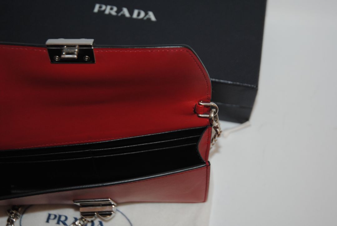 crimson red Prada flap chain bag, Width: 8.5 inches (21.5 cm) Height: 5 inches (12.5 cm) Depth: 2 inches (5 cm) Chain Strap Drop: 22 inches (56 cm)