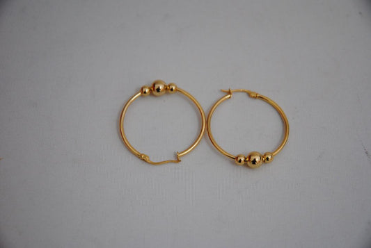 gold NA classic triple ball design hoops, **Hoop Diameter:** Approximately 35mm (1.4”) **Tube Thickness:** Approximately 2mm **Ball Beads:** 3 graduated sizes Large center ball: ~8mm Medium balls: ~6mm each Small ball: ~4mm **Weight:** Approximately 4-6g