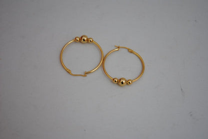 gold NA classic triple ball design hoops, **Hoop Diameter:** Approximately 35mm (1.4”) **Tube Thickness:** Approximately 2mm **Ball Beads:** 3 graduated sizes Large center ball: ~8mm Medium balls: ~6mm each Small ball: ~4mm **Weight:** Approximately 4-6g