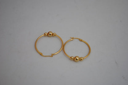 gold NA classic triple ball design hoops, **Hoop Diameter:** Approximately 35mm (1.4”) **Tube Thickness:** Approximately 2mm **Ball Beads:** 3 graduated sizes Large center ball: ~8mm Medium balls: ~6mm each Small ball: ~4mm **Weight:** Approximately 4-6g