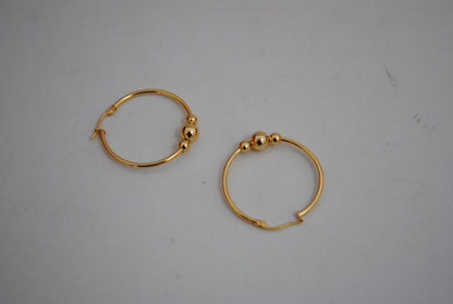 gold NA classic triple ball design hoops, **Hoop Diameter:** Approximately 35mm (1.4”) **Tube Thickness:** Approximately 2mm **Ball Beads:** 3 graduated sizes Large center ball: ~8mm Medium balls: ~6mm each Small ball: ~4mm **Weight:** Approximately 4-6g