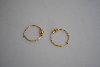 gold NA classic triple ball design hoops, **Hoop Diameter:** Approximately 35mm (1.4”) **Tube Thickness:** Approximately 2mm **Ball Beads:** 3 graduated sizes Large center ball: ~8mm Medium balls: ~6mm each Small ball: ~4mm **Weight:** Approximately 4-6g