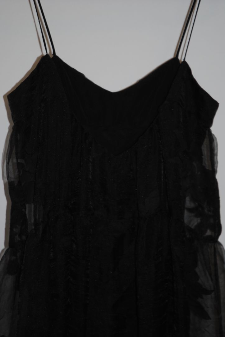 black Free People Black tiered chiffon, 4: Length: approx. 52-60 inches (since appears maxi) Waist: estimate ~26-28 inches (for standard size) Bust: estimate ~34-36 inches Strap drop: adjustable (spaghetti straps)