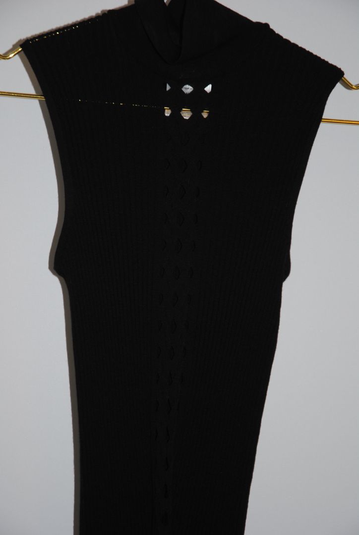 black Christian Dior wool knit top, Dimensions (Approximate): Length: 23 in (58 cm) Bust (flat): 14 in (36 cm) Waist (flat): 12 in (31 cm) Size: FR 40 / US 8 / UK 12 / DE 38