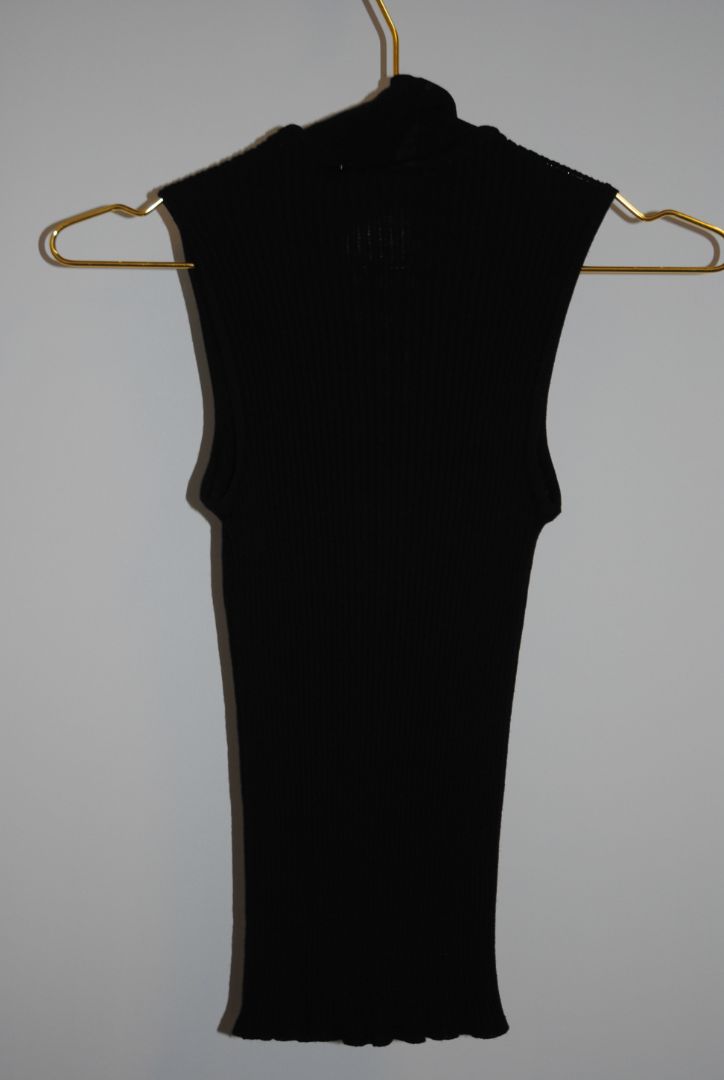 black Christian Dior wool knit top, Dimensions (Approximate): Length: 23 in (58 cm) Bust (flat): 14 in (36 cm) Waist (flat): 12 in (31 cm) Size: FR 40 / US 8 / UK 12 / DE 38