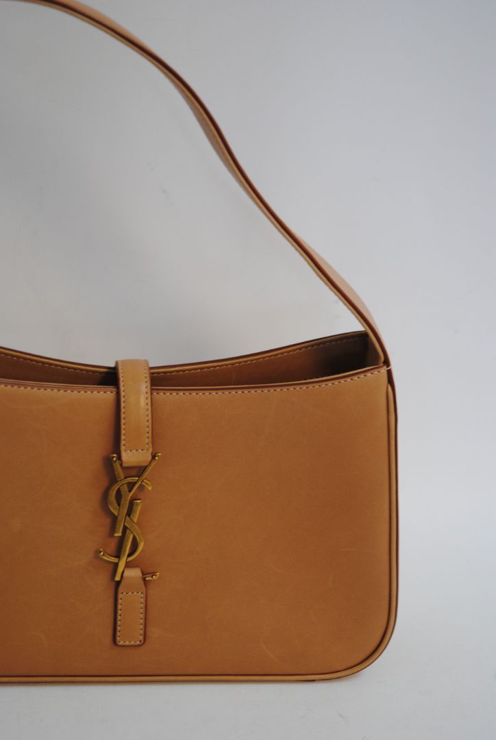 tan/ caramel Saint Laurent Model: Le 5 À 7 Hobo Bag, Length: 9.8 in (25 cm) Height: 5.5 in (14 cm) Depth: 2.4 in (6 cm) Strap Drop: 8.6–10.2 in (adjustable)