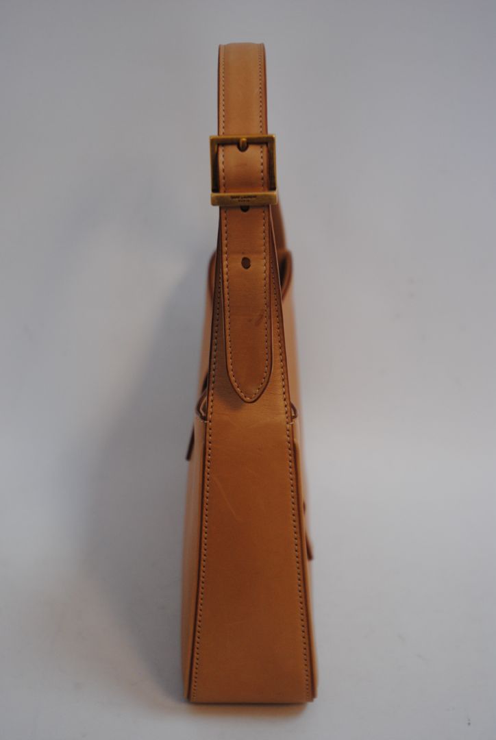 tan/ caramel Saint Laurent Model: Le 5 À 7 Hobo Bag, Length: 9.8 in (25 cm) Height: 5.5 in (14 cm) Depth: 2.4 in (6 cm) Strap Drop: 8.6–10.2 in (adjustable)