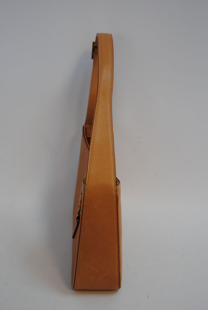 tan/ caramel Saint Laurent Model: Le 5 À 7 Hobo Bag, Length: 9.8 in (25 cm) Height: 5.5 in (14 cm) Depth: 2.4 in (6 cm) Strap Drop: 8.6–10.2 in (adjustable)