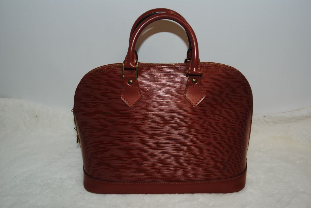 camel Louis Vuitton Epi Alma MM, Dimensions Length: 14.2 in (36 cm) Height: 10.6 in (27 cm) Depth: 6.7 in (17 cm)