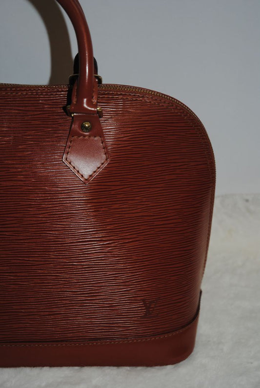 camel Louis Vuitton Epi Alma MM, Dimensions Length: 14.2 in (36 cm) Height: 10.6 in (27 cm) Depth: 6.7 in (17 cm)