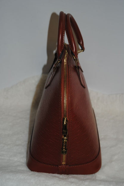 camel Louis Vuitton Epi Alma MM, Dimensions Length: 14.2 in (36 cm) Height: 10.6 in (27 cm) Depth: 6.7 in (17 cm)
