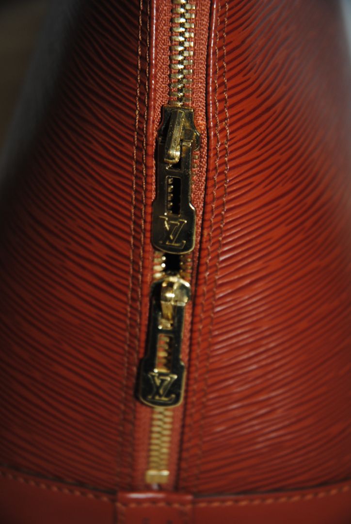 camel Louis Vuitton Epi Alma MM, Dimensions Length: 14.2 in (36 cm) Height: 10.6 in (27 cm) Depth: 6.7 in (17 cm)