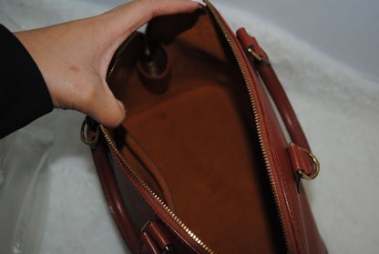 camel Louis Vuitton Epi Alma MM, Dimensions Length: 14.2 in (36 cm) Height: 10.6 in (27 cm) Depth: 6.7 in (17 cm)
