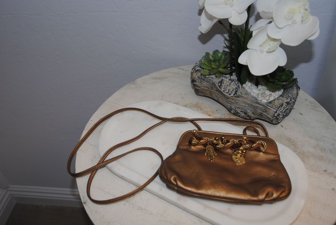 copper gold Braccialini Designer bag, Width: ~12 in (30 cm) Height: ~7.5 in (19 cm) Depth: ~4 in (10 cm) Strap Drop: ~18–20 in (shoulder length)