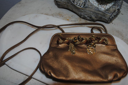 copper gold Braccialini Designer bag, Width: ~12 in (30 cm) Height: ~7.5 in (19 cm) Depth: ~4 in (10 cm) Strap Drop: ~18–20 in (shoulder length)
