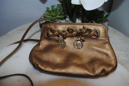 copper gold Braccialini Designer bag, Width: ~12 in (30 cm) Height: ~7.5 in (19 cm) Depth: ~4 in (10 cm) Strap Drop: ~18–20 in (shoulder length)