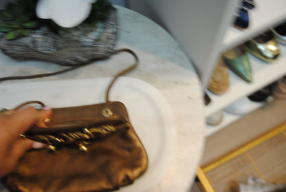 copper gold Braccialini Designer bag, Width: ~12 in (30 cm) Height: ~7.5 in (19 cm) Depth: ~4 in (10 cm) Strap Drop: ~18–20 in (shoulder length)