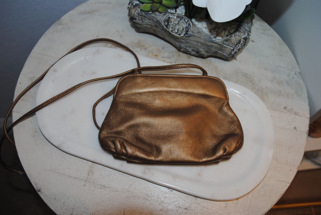 copper gold Braccialini Designer bag, Width: ~12 in (30 cm) Height: ~7.5 in (19 cm) Depth: ~4 in (10 cm) Strap Drop: ~18–20 in (shoulder length)