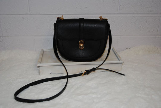 black Oryany half moon cross body, Width: 9–9.5 in Height: 7 in Depth: 2.5–3 in Strap Drop: Adjustable 19–23 in