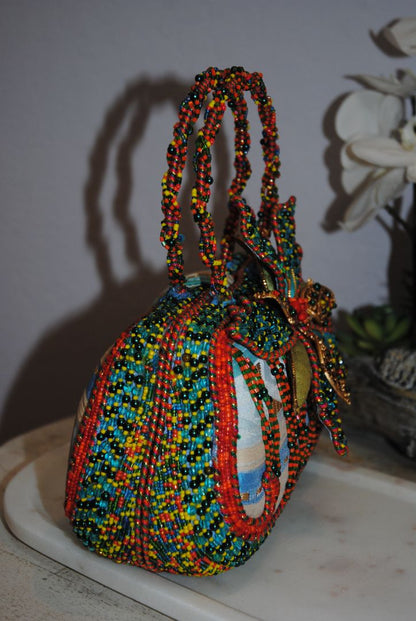 multi color Mary Frances handmade beaded bag, Width: 9–10 in Height: 6–7 in (without handle) Depth: 3–3.5 in Handle Drop: 4–5 in (handheld braided bead handle)