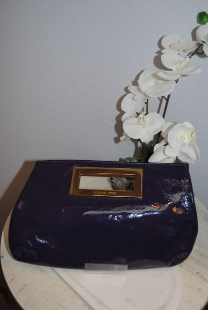 purple Michael Kors clutch with magnet closure, small