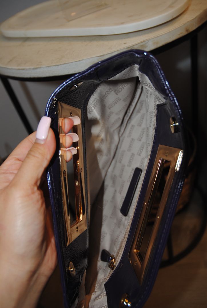 purple Michael Kors clutch with magnet closure, small