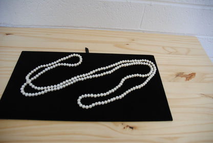 white NA opera necklace