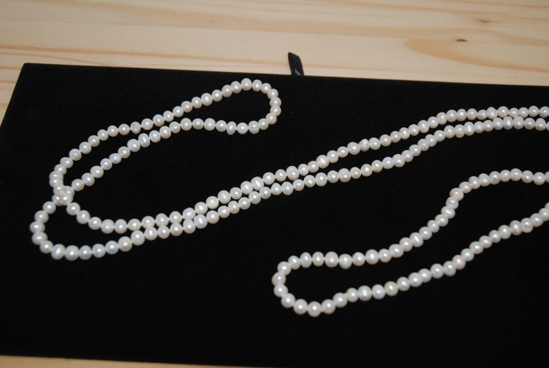 white NA opera necklace