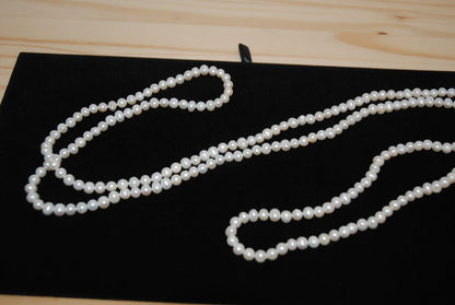 white NA opera necklace