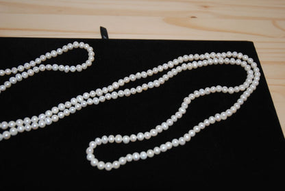 white NA opera necklace