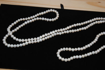 white NA opera necklace