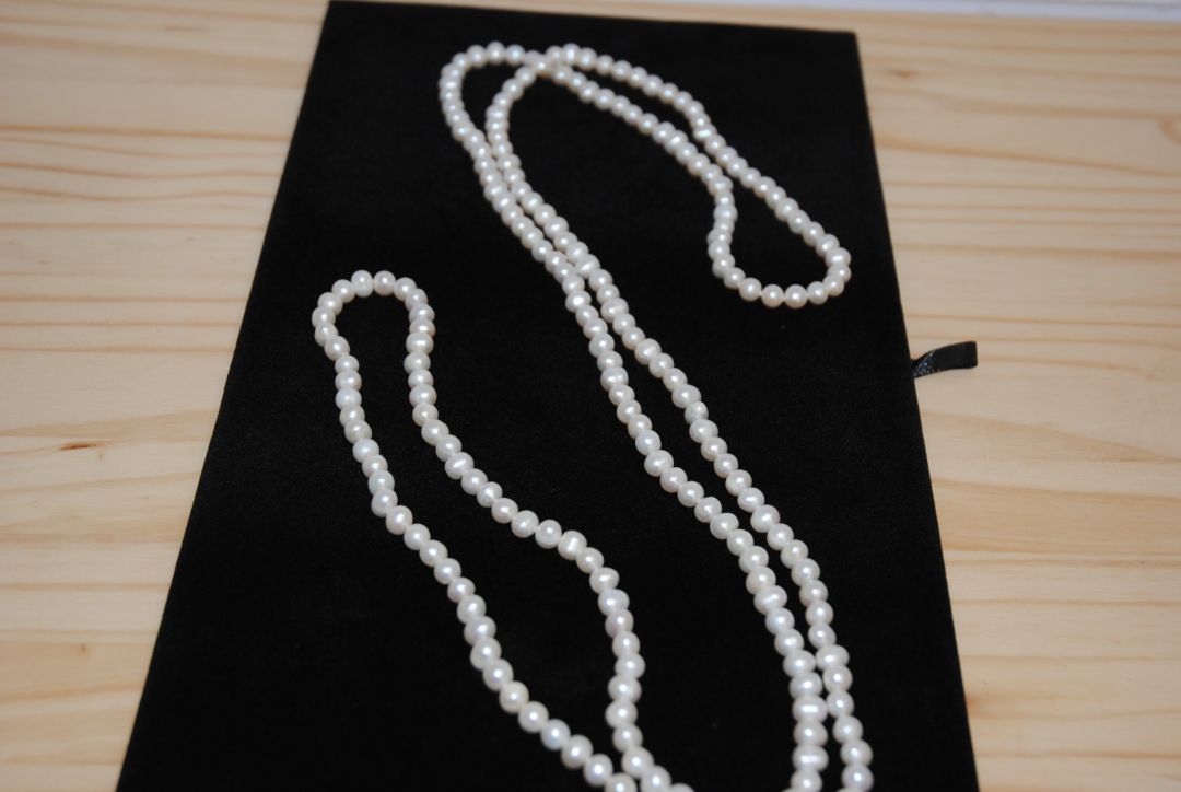 white NA opera necklace