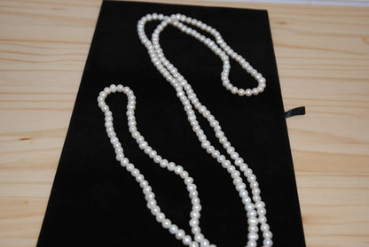 white NA opera necklace