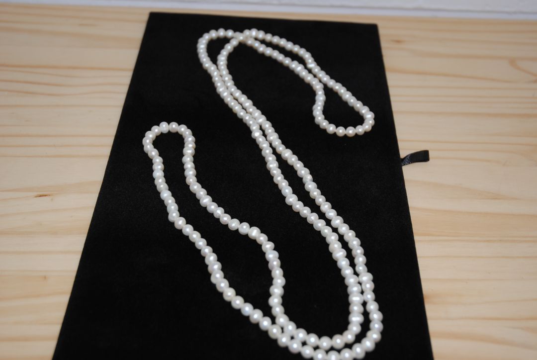 white NA opera necklace